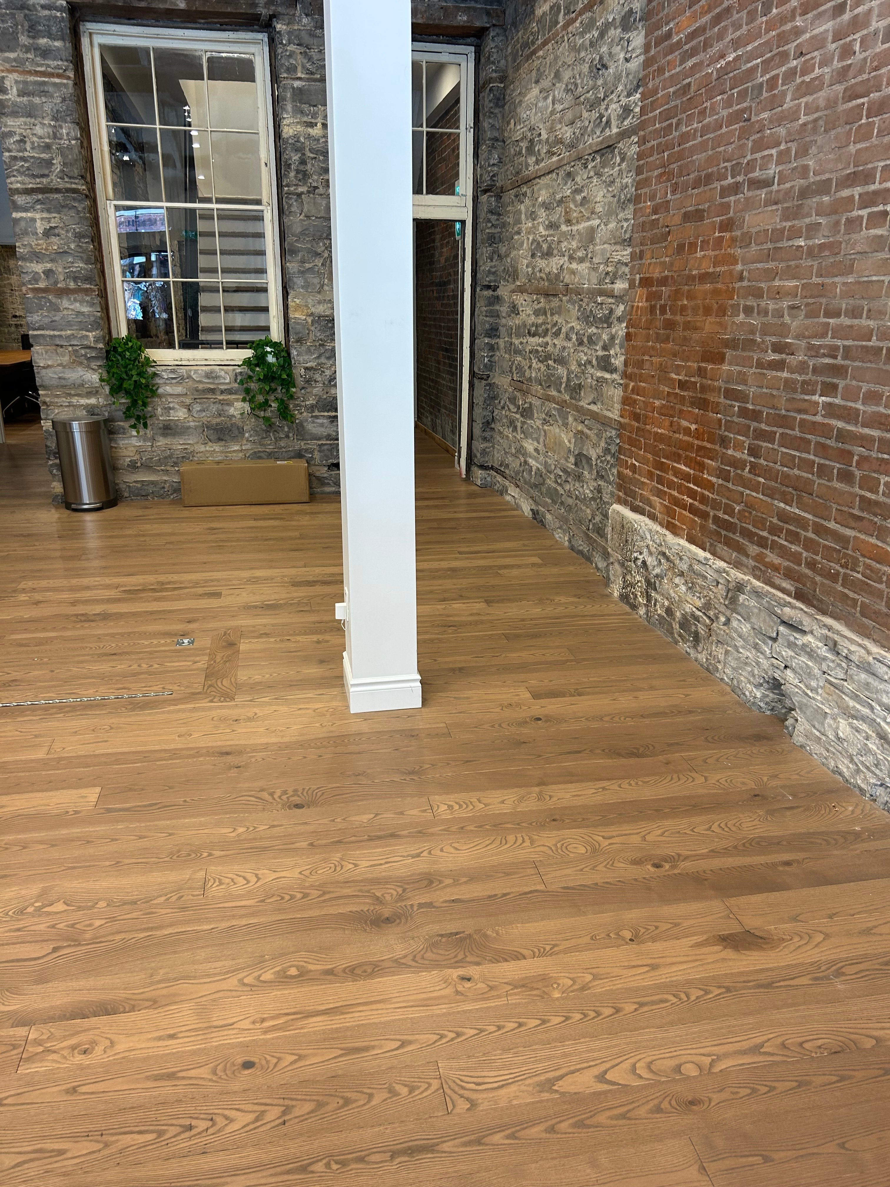 Mid Tone Ash Hardwood Flooring in an Office setting