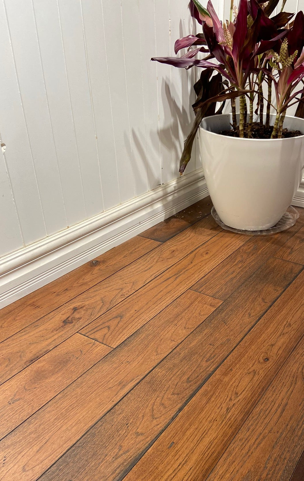 Rustic Hickory hardwood flooring in a mid tone stain with a black stain first. Gives rustic elements and colour variation throuhgout.